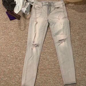 Grey colored ripped skinny jeans